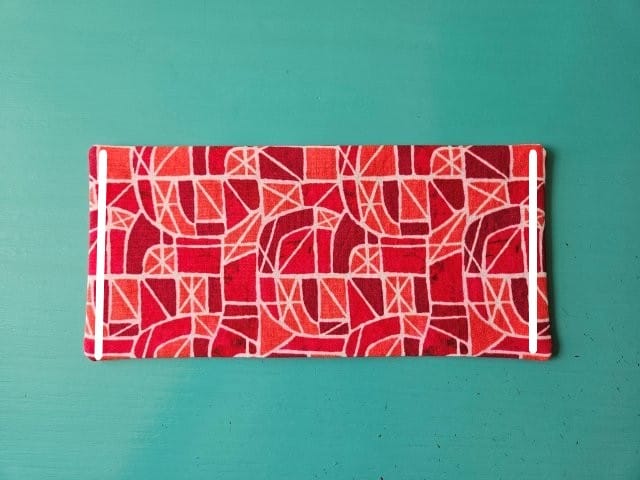 Top stitch short sides of business card holder