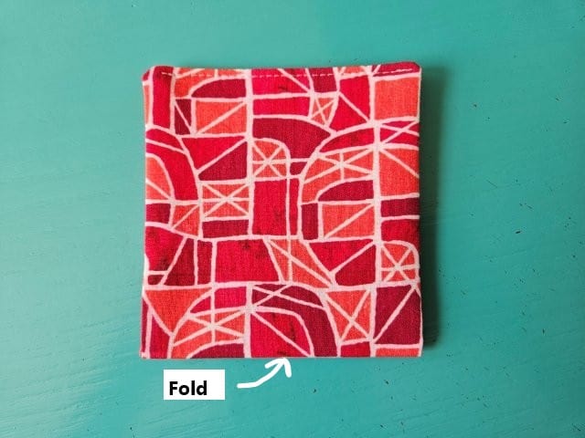 Fold in half with short sides together