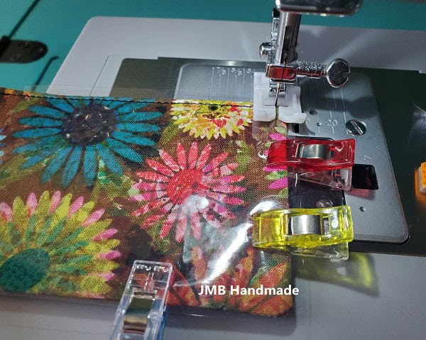 Sew the vinyl onto the luggage tag