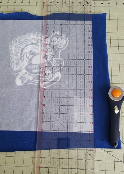 Cut t-shirt quilt blocks using template