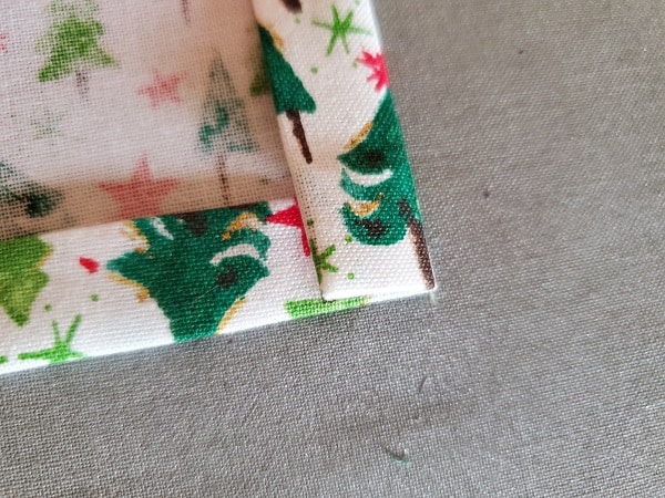 Hem all the edges of fabric napkin