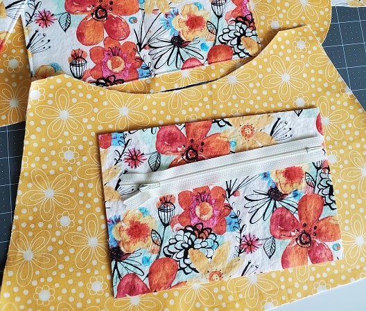 Sew an optional zipper pocket to other lining fabric piece