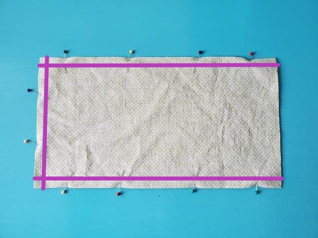 Pin three sides of cover with purple lines to show where to sew