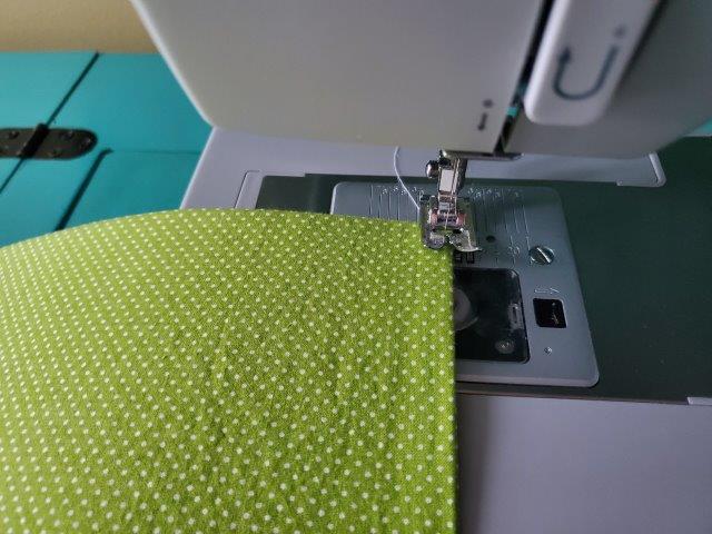 Sew the cover closed close to edge without sewing the mesh