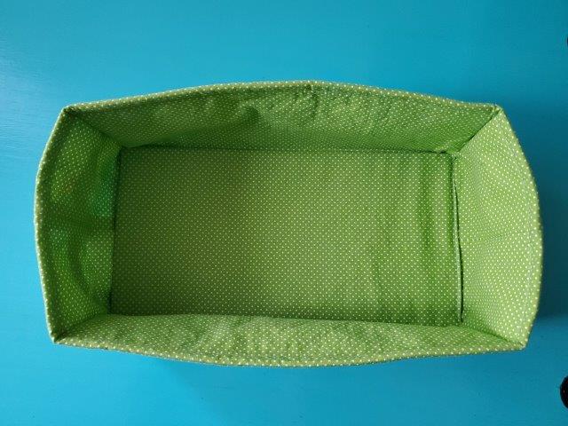 Place removeable mesh bottom into fabric rectangle basket