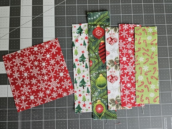 Fabric strips cut and fabric square back for square coaster