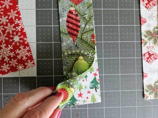 Sew first and second fabric coaster strips together