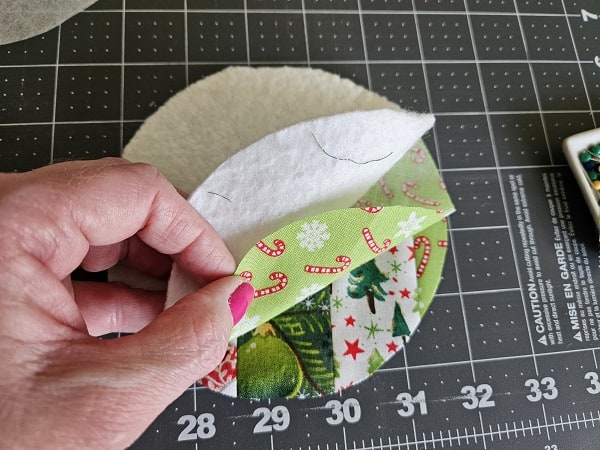 Circle coaster fabric right sides together with batting on top.
