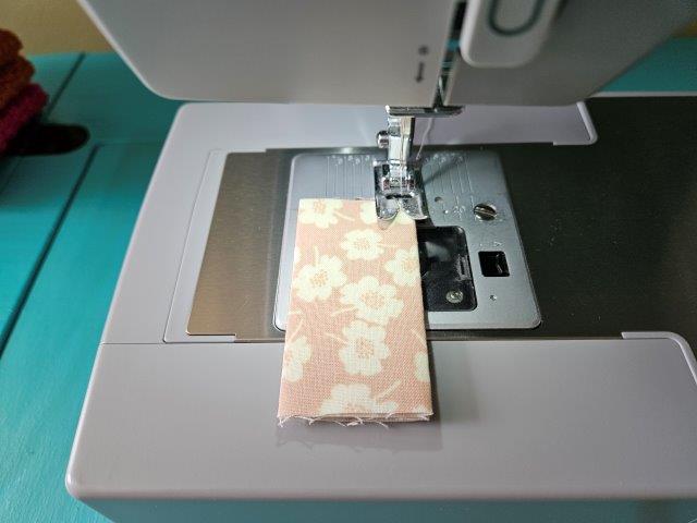 Sew each short strap along the folded edges.