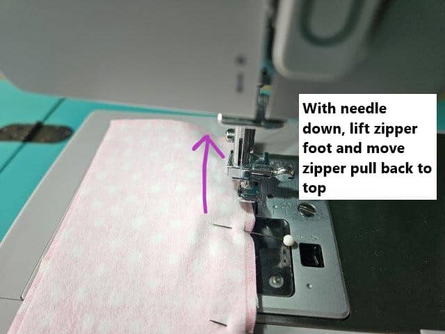 Move the zipper pull back to top
