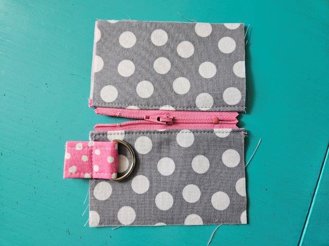 Open mini pouch zipper halfway for sewing
