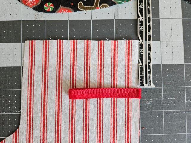 Attach ribbon to one of the stocking lining fabric pieces.