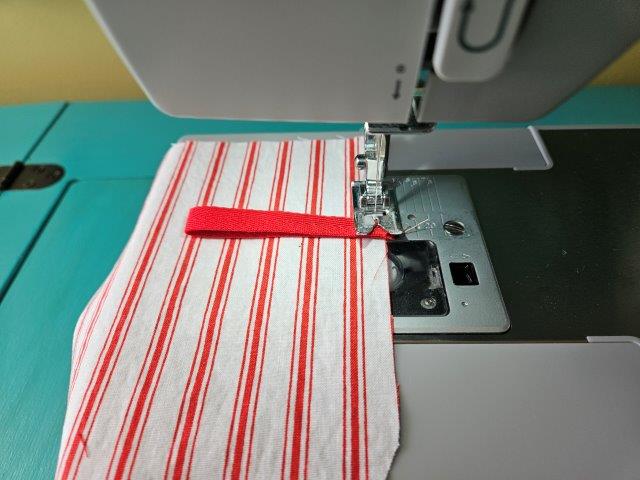 Baste the ribbon to the lining fabric piece