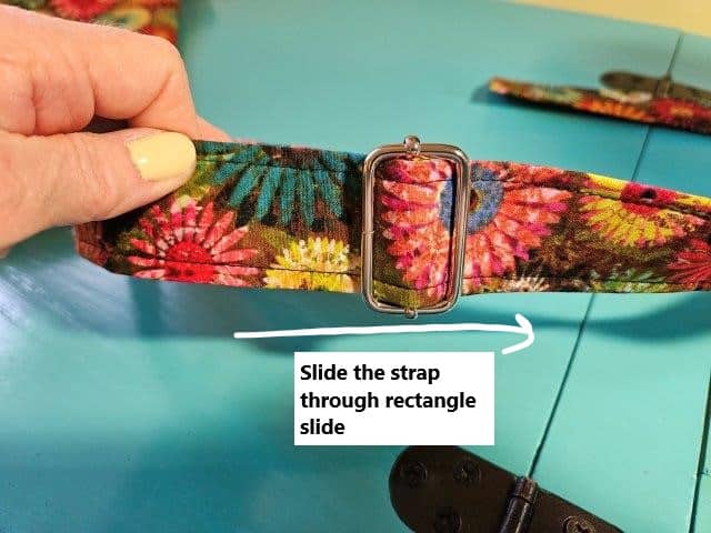 End of strap all the way through rectangle slide