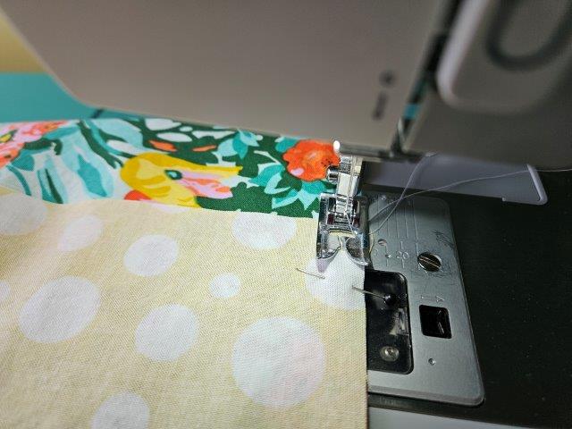 Sew the top fabric to the bottom fabric of the napkin