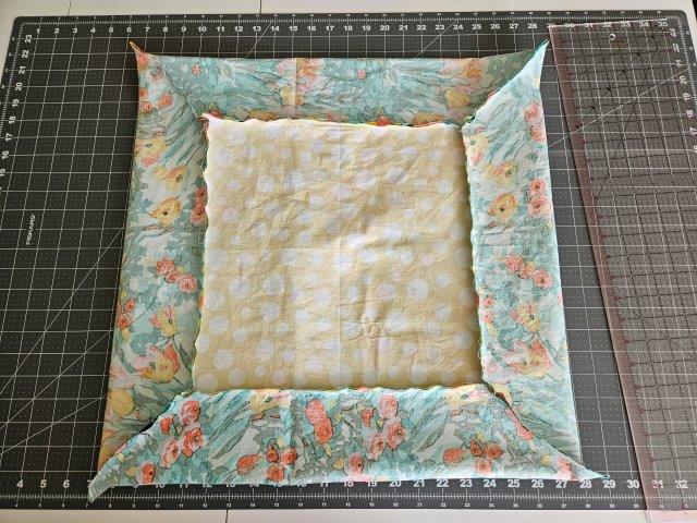 Fabric napkin with corners trimmed.