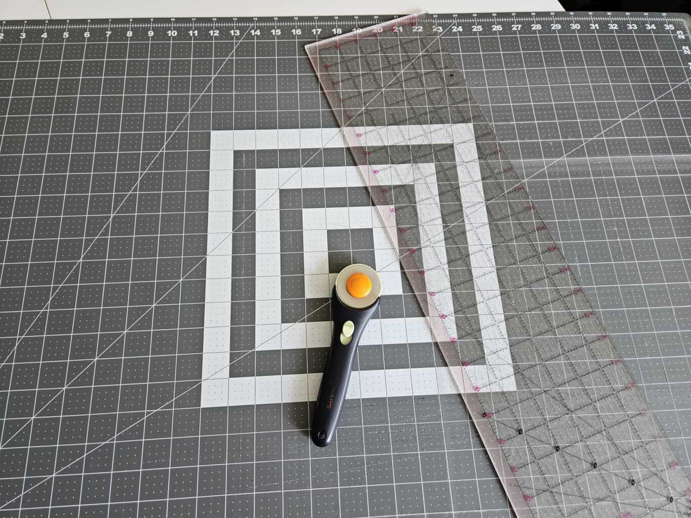 Fiskars cutting mat, rotary cutter, and clear ruler