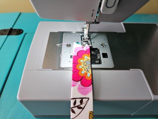 Sew the strap along each edge lengthwise