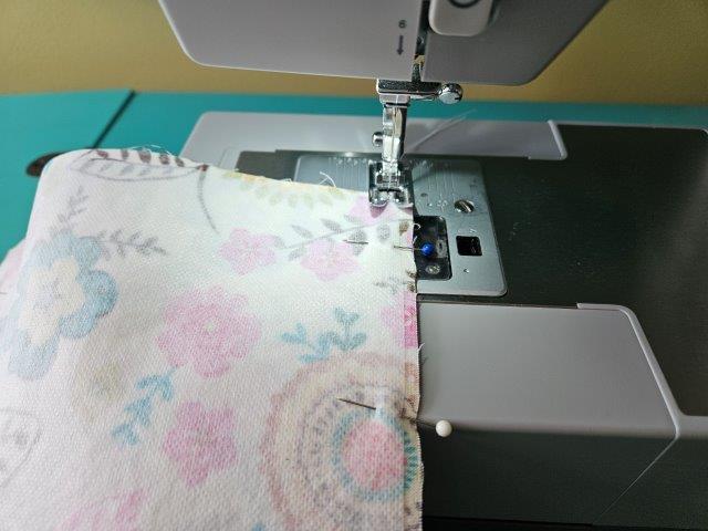 Sew along sides and bottom of outer fabric pieces