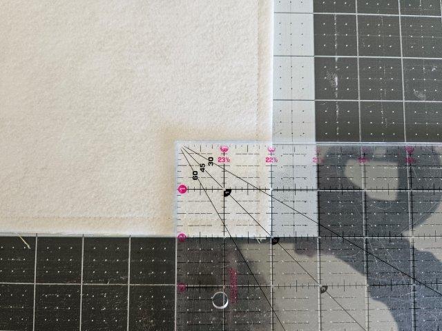 Cut 2 inch squares from each bottom corner