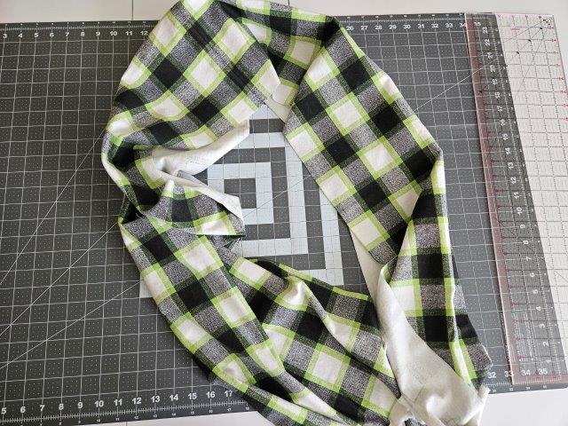 Flannel scarf with pieces sewn together and edges straight