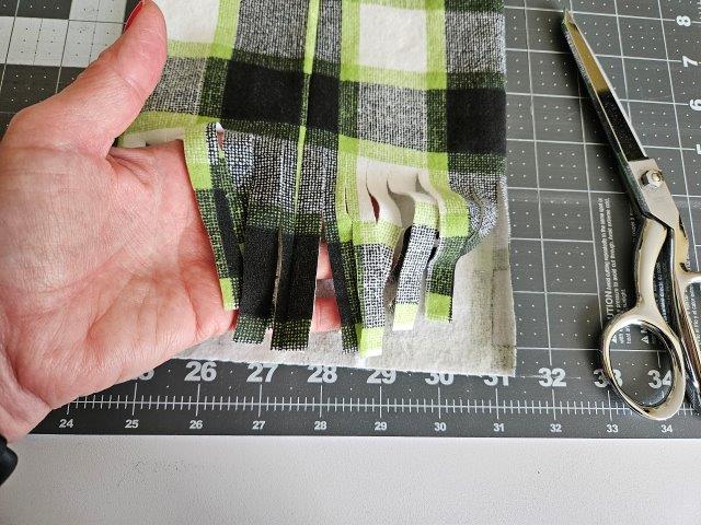 Cut strips to make the scarf fringe