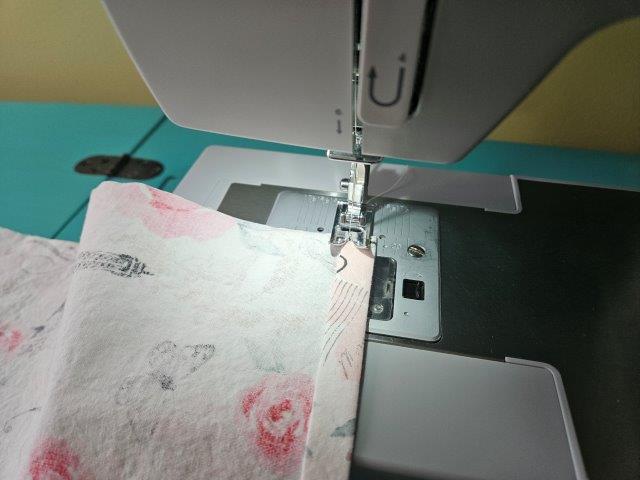 Top stitch the hem on the sewing machine cover