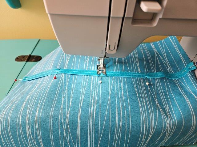 Sew the elastic to the lining where marked or pinned