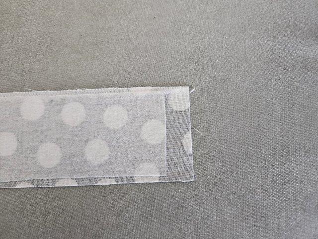 Interfacing 1/2" shorter to allow for hemming the long strap