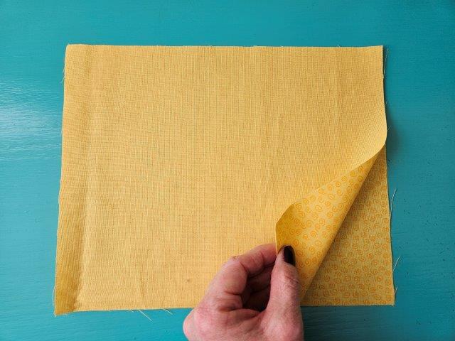 Place the hot pad pocket fabric right sides together