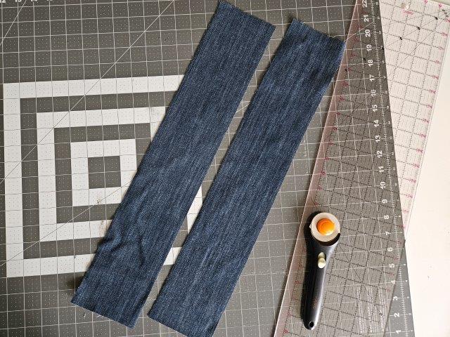 Cut the bag straps out of the jeans legs