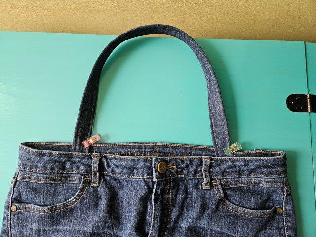 Attach the straps to the denim jeans handbag