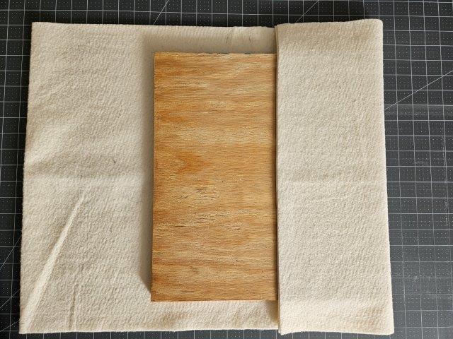 Fold over one side of the batting