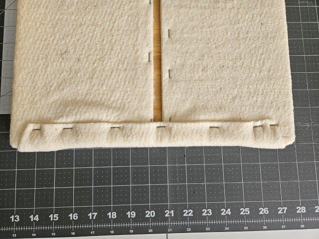 Fold over other corner and staple corner and middle