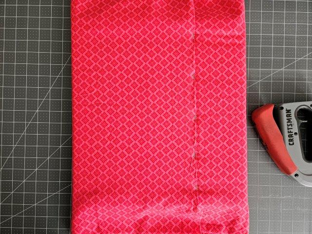 Fold over the other side of the fabric and staple