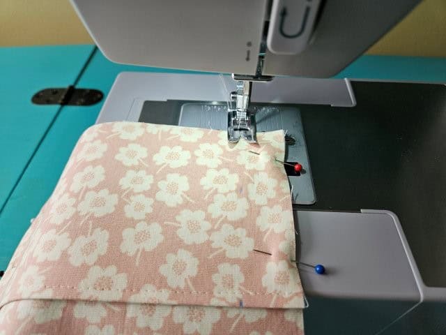 Sew the other pocket 1-inch from each edge