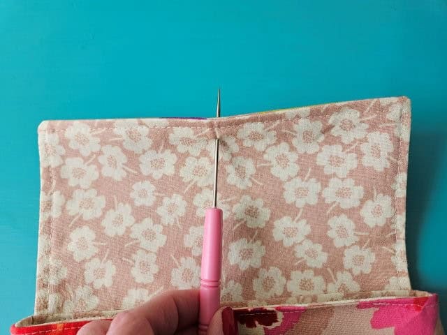 Make a hold in the flap in the middle with awl tool