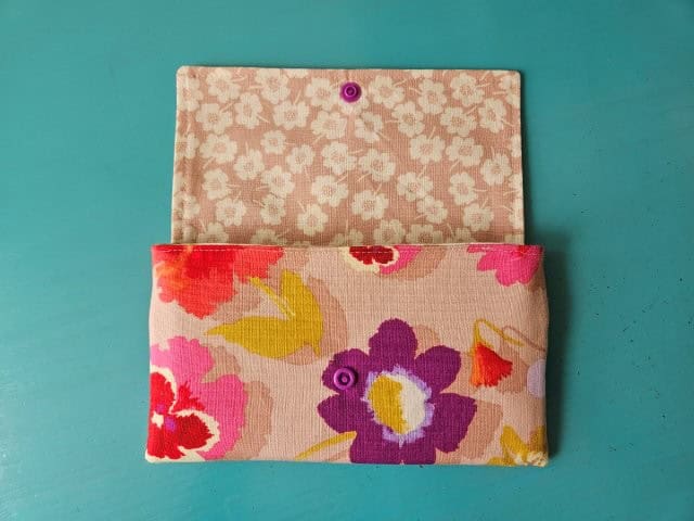 Finished fabric wallet with flap open