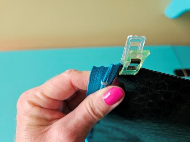 Fold the vinyl and clip to hold in place