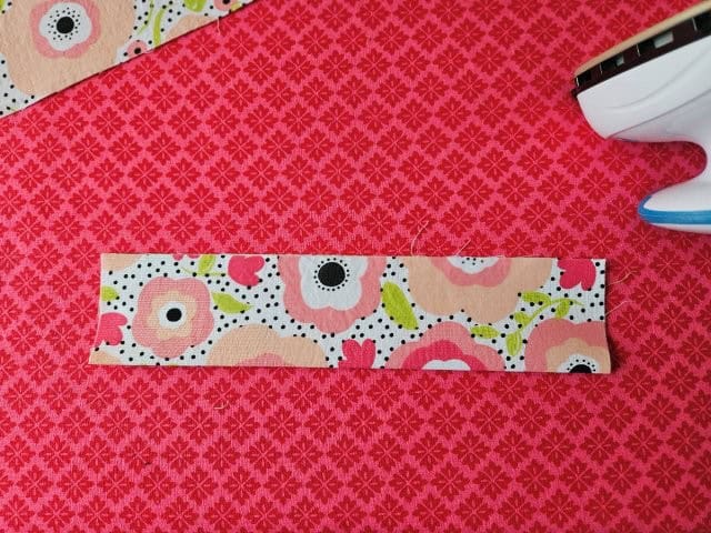 Fold the strap in half lengthwise