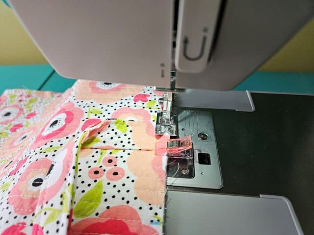 Baste the strap to the laptop case