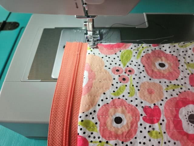 Top stitch along the zipper