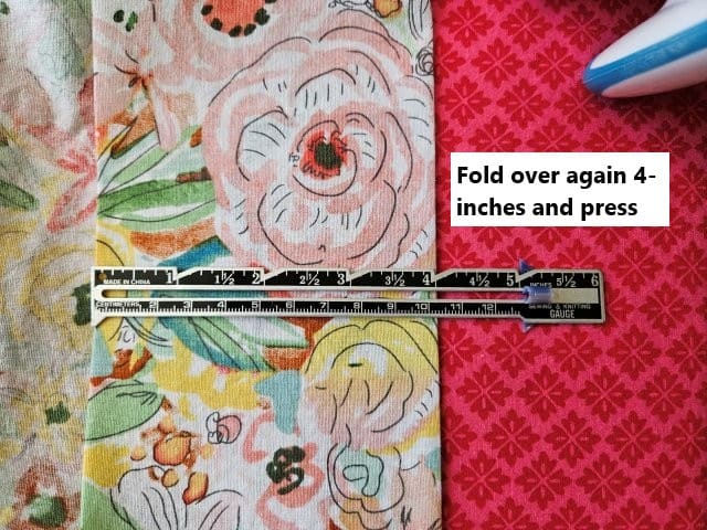 Fold over 4 inches and press