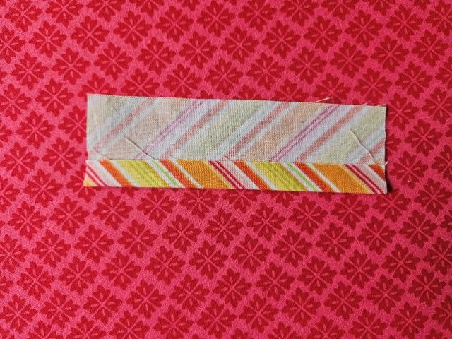 Fold the strap to the center fold