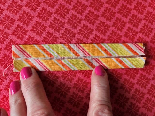 Fold the other side of the strap to the center