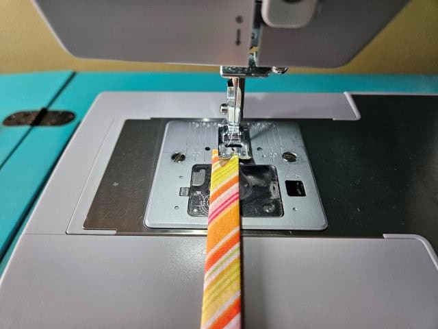 Sew the strap along each fold lengthwise
