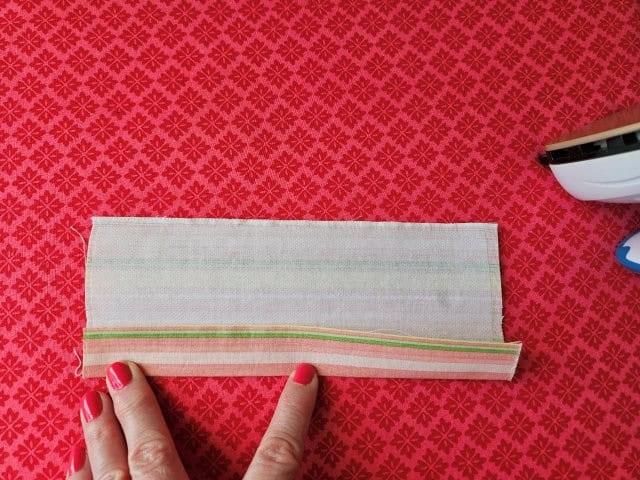 Open up the handle and fold to the center