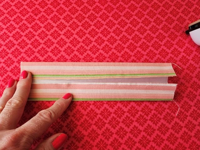 Turn and fold other side of handle to center