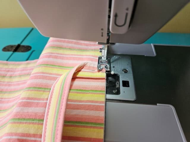 Baste the handles to the outer basket fabric