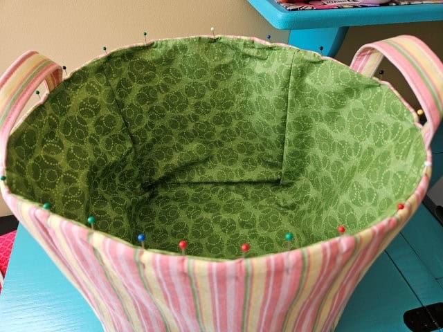 Fold over the stabilizer and pin around the top of the basket